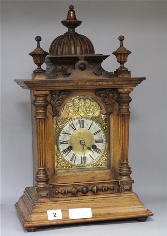 A late Victorian walnut mantel clock